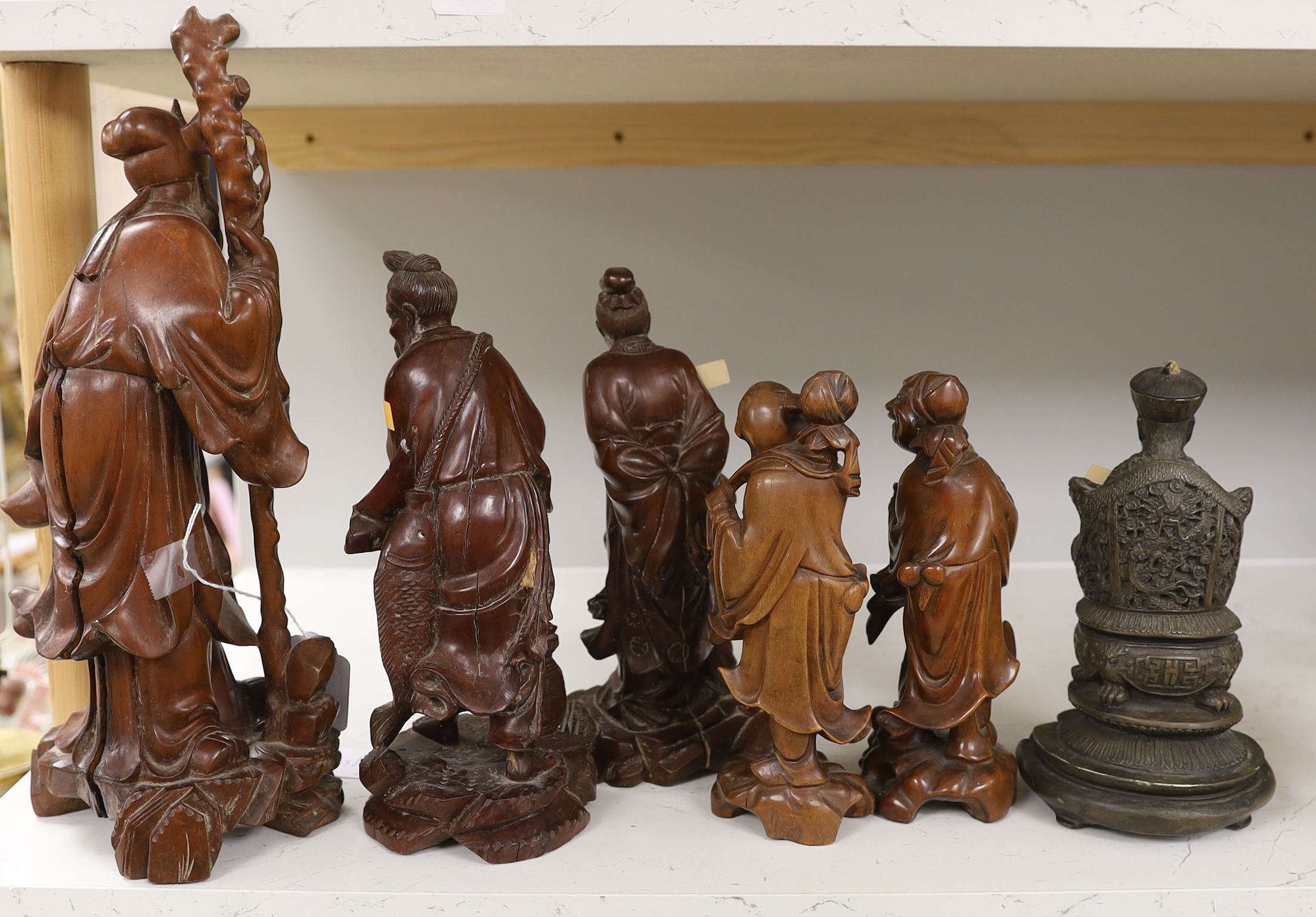 A group of five Chinese carved hardwood figures and another